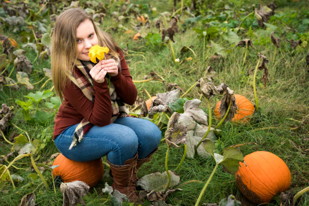 istock Teen in pumpkin patch 1061535698