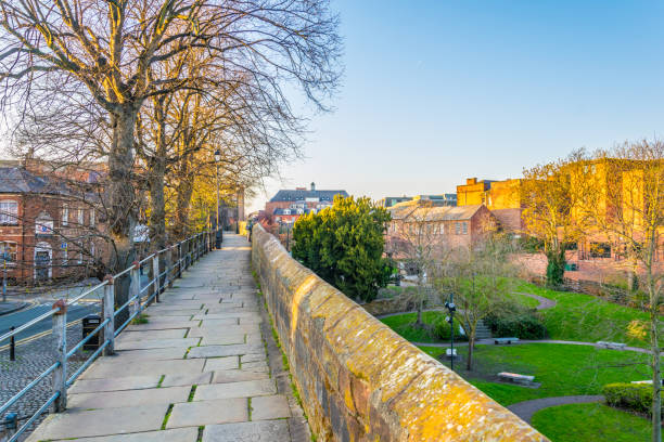 walls of Chester surrounding the old town, England walls of Chester surrounding the old town, England chester england stock pictures, royalty-free photos & images