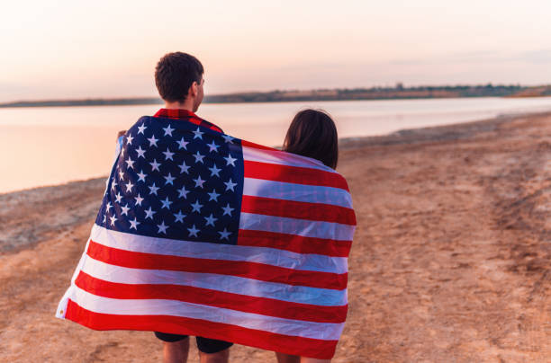 istock oung couple on the beach walking together 1061554806