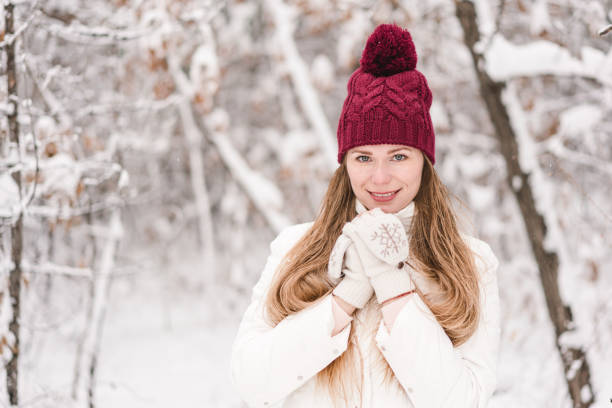 istock Smiling young woman outdoors in a winter forest 1061568088