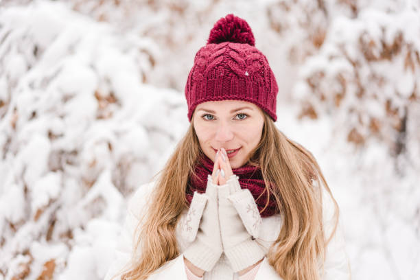 istock Smiling young woman outdoors in a winter forest 1061568272