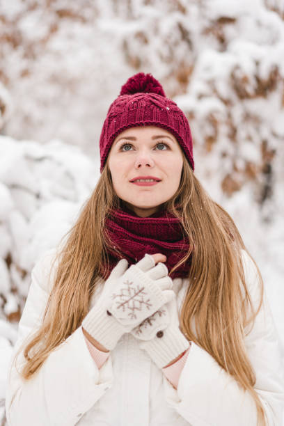 istock Smiling young woman outdoors in a winter forest 1061568320