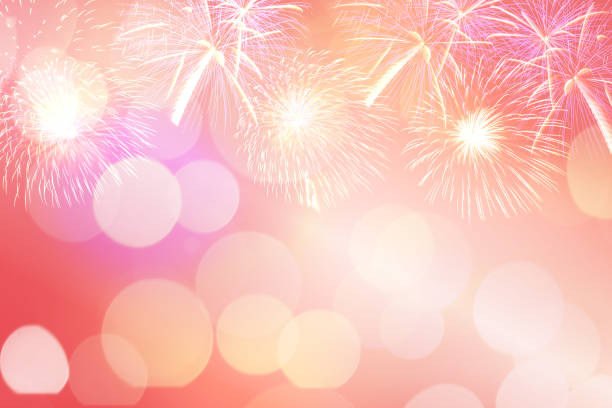 Colorful firework and blurred bokeh light with copy space in Christmas and New Year. Abstract background holiday concept.
