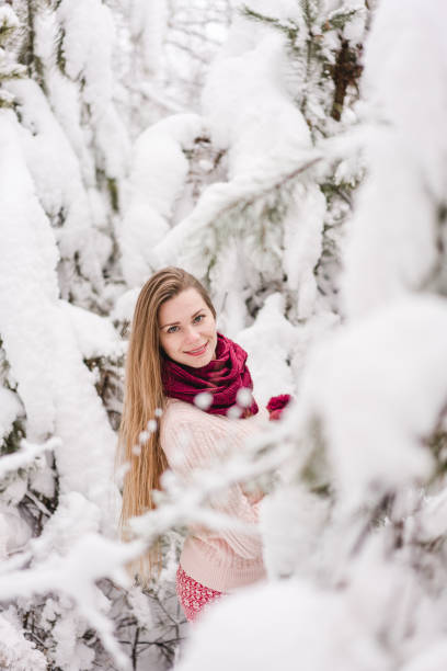 istock Smiling young woman outdoors in a winter forest 1061572472