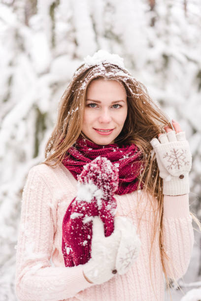 istock Smiling young woman outdoors in a winter forest 1061572604