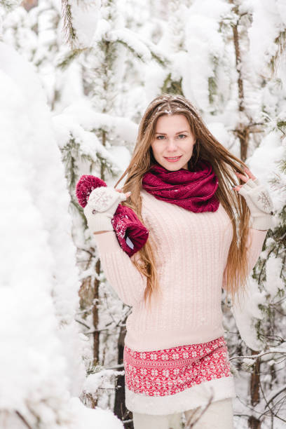 istock Smiling young woman outdoors in a winter forest 1061572630