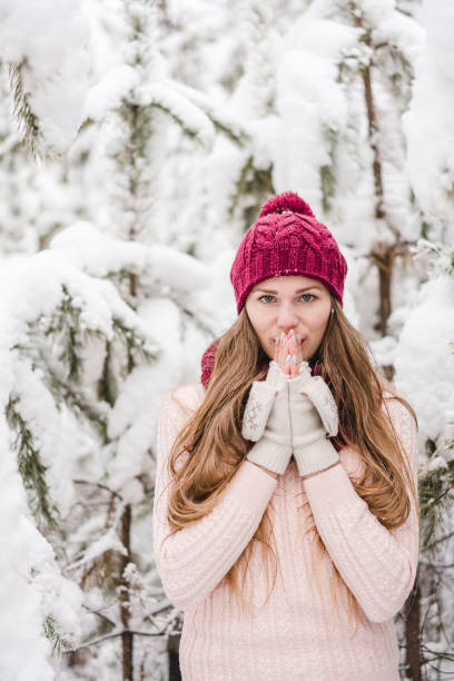 istock Smiling young woman outdoors in a winter forest 1061572650