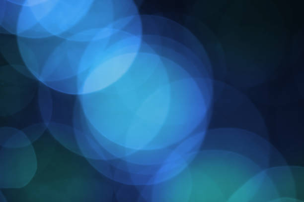 istock Abstract blurred colorful bokeh lights background. Defocused glitter light. 1061575828