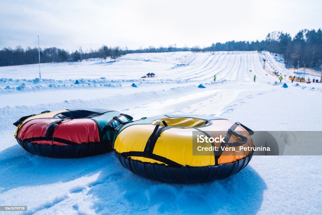 snow tubing. sleigh on the top of the hill. winter activity snow tubing. sleigh on the top of the hill. winter activity concept Snow Tubing Stock Photo