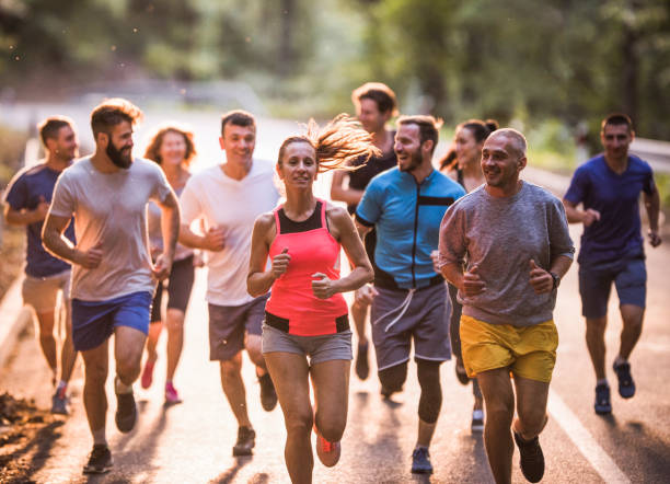 istock Group of marathon runners having a race through nature. 1061588450