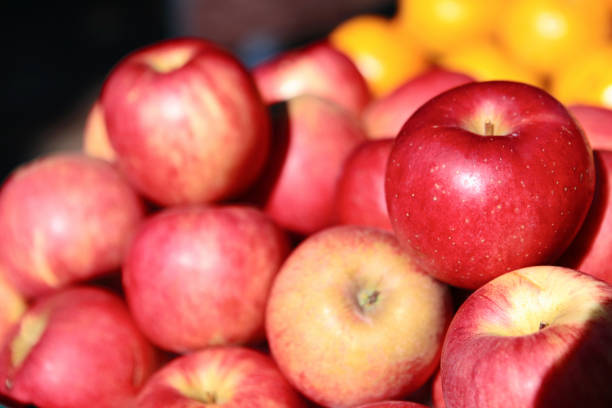 istock Fresh apples on the table in market with sunlight 1061590592