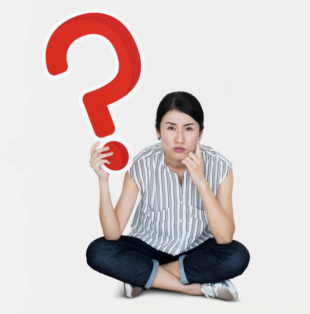 istock Confused woman holding a question mark icon 1061593914