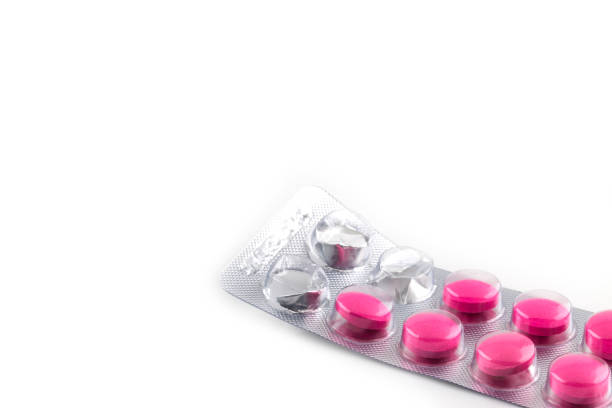 istock pink pills in package isolated on white 1061595780