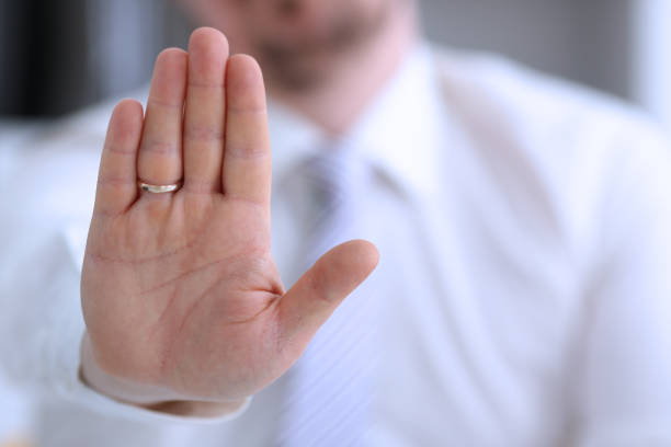 istock Male arm show palm during conference conversation 1061597500