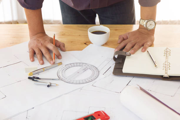 istock Engineer and Architect concept, Engineer Architects and real estate agent office team working with blueprints 1061600006