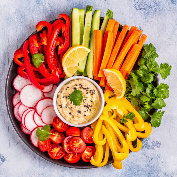 istock Homemade hummus with fresh vegetables 1061604152