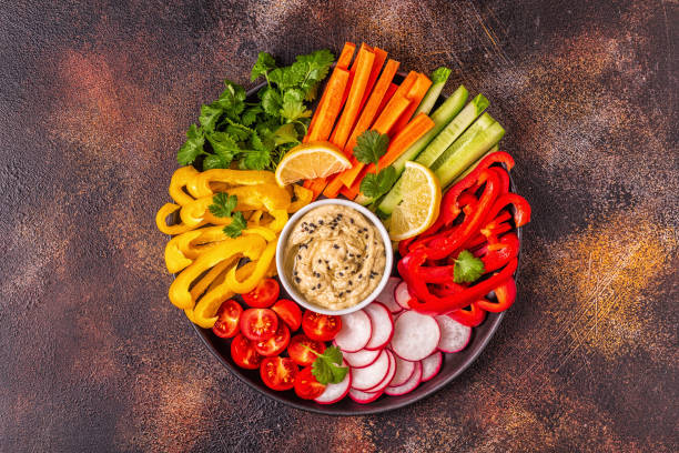 istock Homemade hummus with fresh vegetables 1061604290