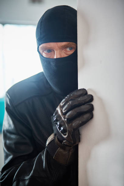 istock Disguised man with bad intentions creeps closer 1061609092
