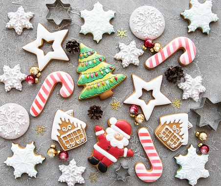 Christmas homemade gingerbread cookies on a concrete background
