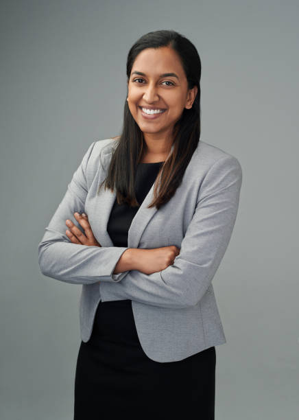 Confidence is a vital quality for success Studio portrait of a young businesswoman standing against a grey background Blazer stock pictures, royalty-free photos & images