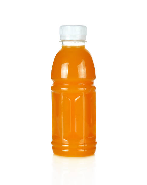 istock Plastic bottles of orange juice, mango isolated on white 1061615626