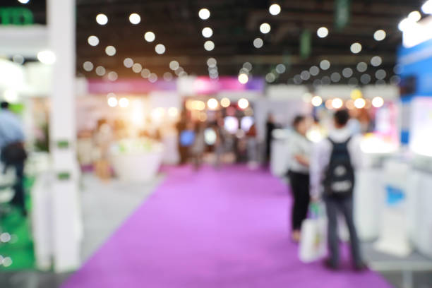 istock blurred image of people walking in shopping center (abstract background) 1061617034