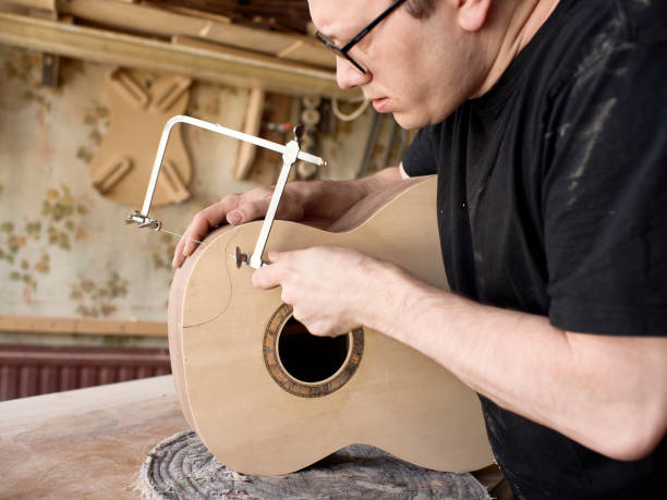 istock The process of making a cutaway on a classical guitar. 1061617996