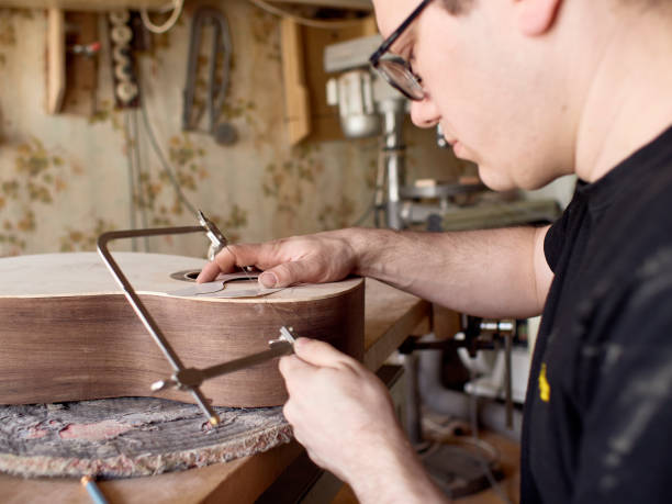 istock The process of making a cutaway on a classical guitar. 1061618002