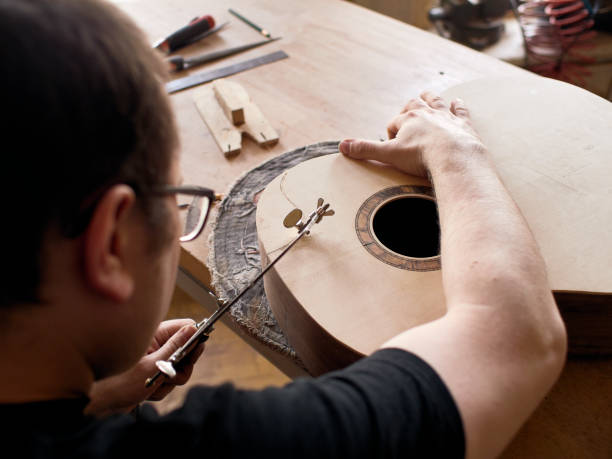 istock The process of making a cutaway on a classical guitar. 1061618026