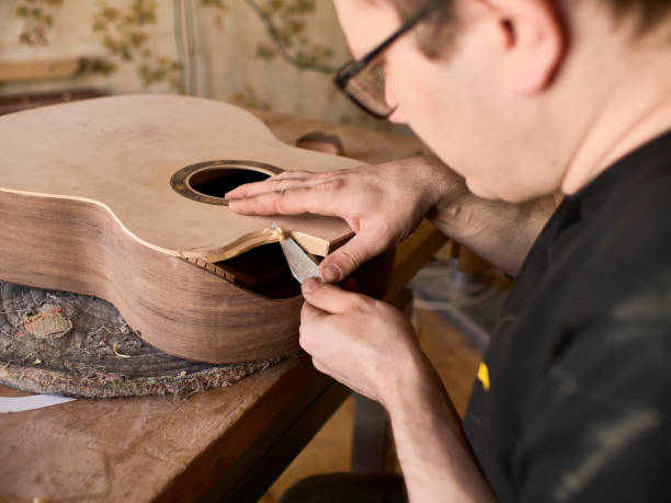 istock The process of making a cutaway on a classical guitar. 1061618040