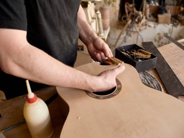 istock The process of making a cutaway on a classical guitar. 1061618042