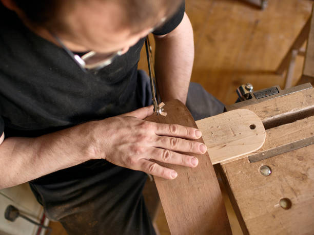 istock The process of making a cutaway on a classical guitar. 1061618046