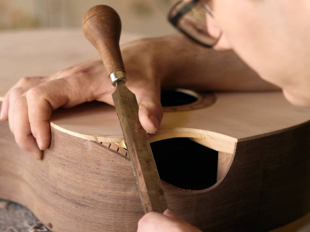 istock The process of making a cutaway on a classical guitar. 1061618050