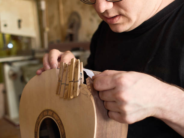 istock The process of making a cutaway on a classical guitar. 1061618056