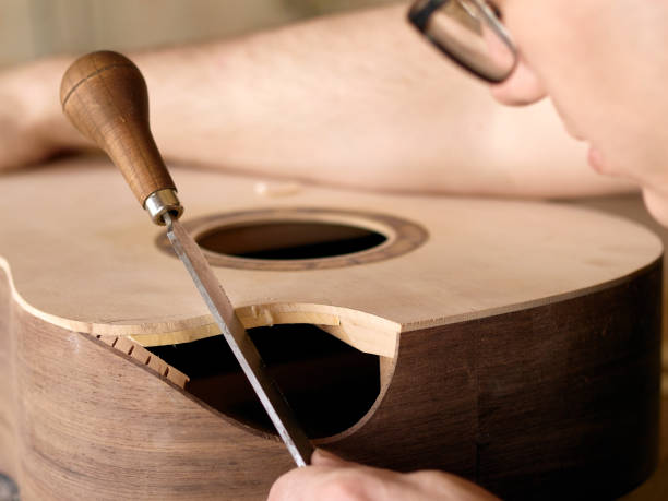 istock The process of making a cutaway on a classical guitar. 1061618062