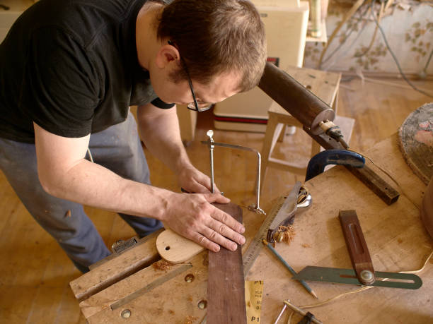istock The process of making a cutaway on a classical guitar. 1061618292