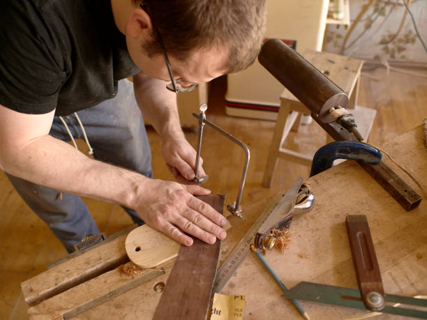 istock The process of making a cutaway on a classical guitar. 1061618304