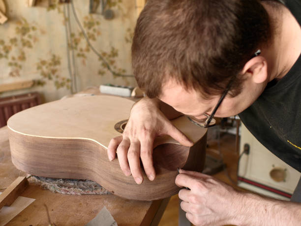 istock The process of making a cutaway on a classical guitar. 1061618390