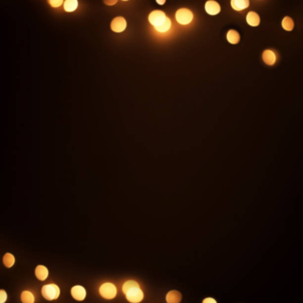 istock Abstract Golden lights on  black  background. Defocused  Glowing light bulb garland, copyspace 1061619952