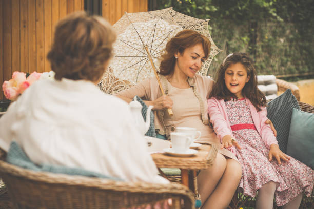 istock Woman relaxing with family 1061622080