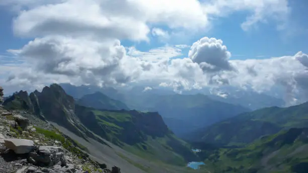 A view of a gorgeous mountain landscape with small lakes and a great view of the Alps near Klosters in Switzerland