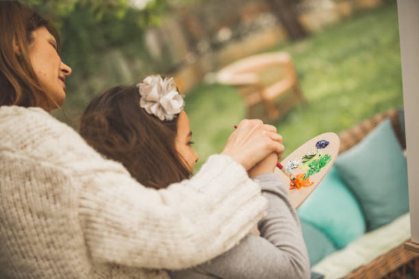 istock Artists mixing paint on a palette 1061622406