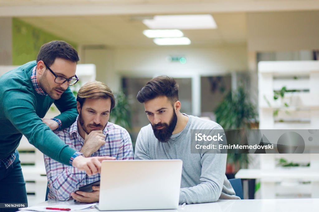 Software Developers Solving A Problem Using Laptop Stock Photo ...