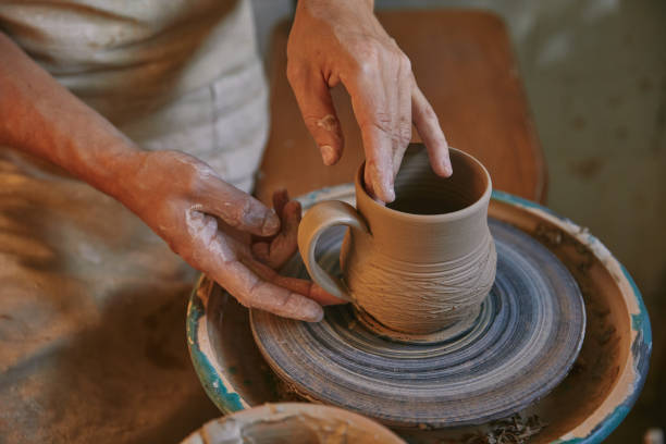 istock cropped image of professional potter working on pottery wheel at workshop 1061625702