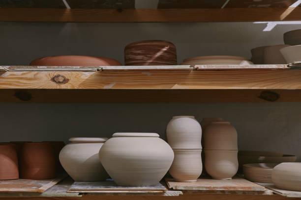 istock ceramic bowls and dishes on wooden shelves at pottery studio 1061626846