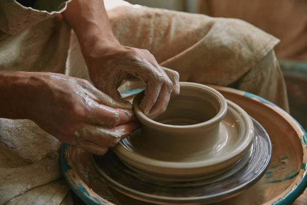 istock partial view of male craftsman working on potters wheel at pottery studio 1061626976