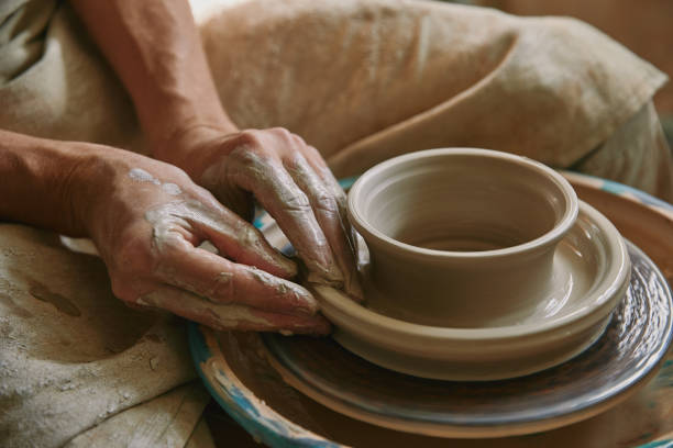 istock close up view of professional potter working on pottery wheel at workshop 1061626996