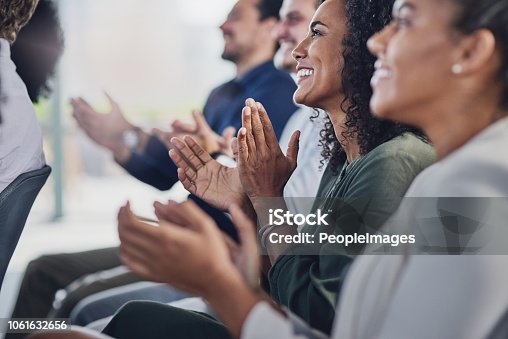 istock Acknowledging a colleague's achievement 1061632656