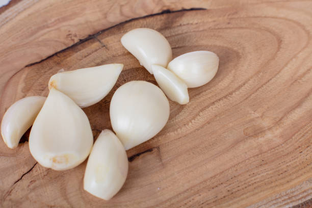 Spain, Palma Majorca, April 25, 2024 -Bundled garlic bulbs at market