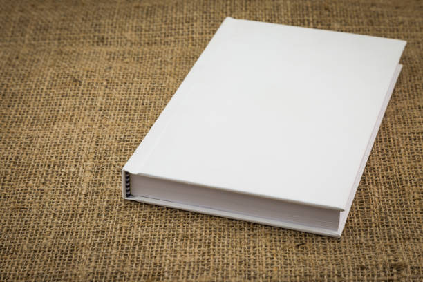 istock White book on sackcloth textured brown 1061636510